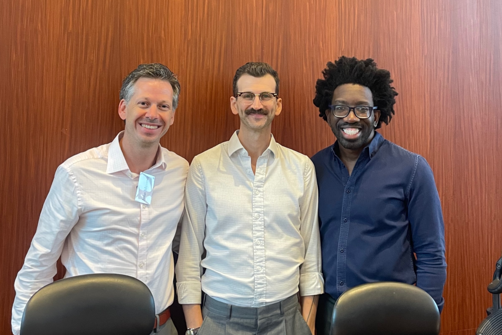 John Meixner (JD '12; PhD '13), Ryan Whalen (JD-PhD '16), and Raff Donelson (JD-PhD '17)  at a conference at the University of Hong Kong