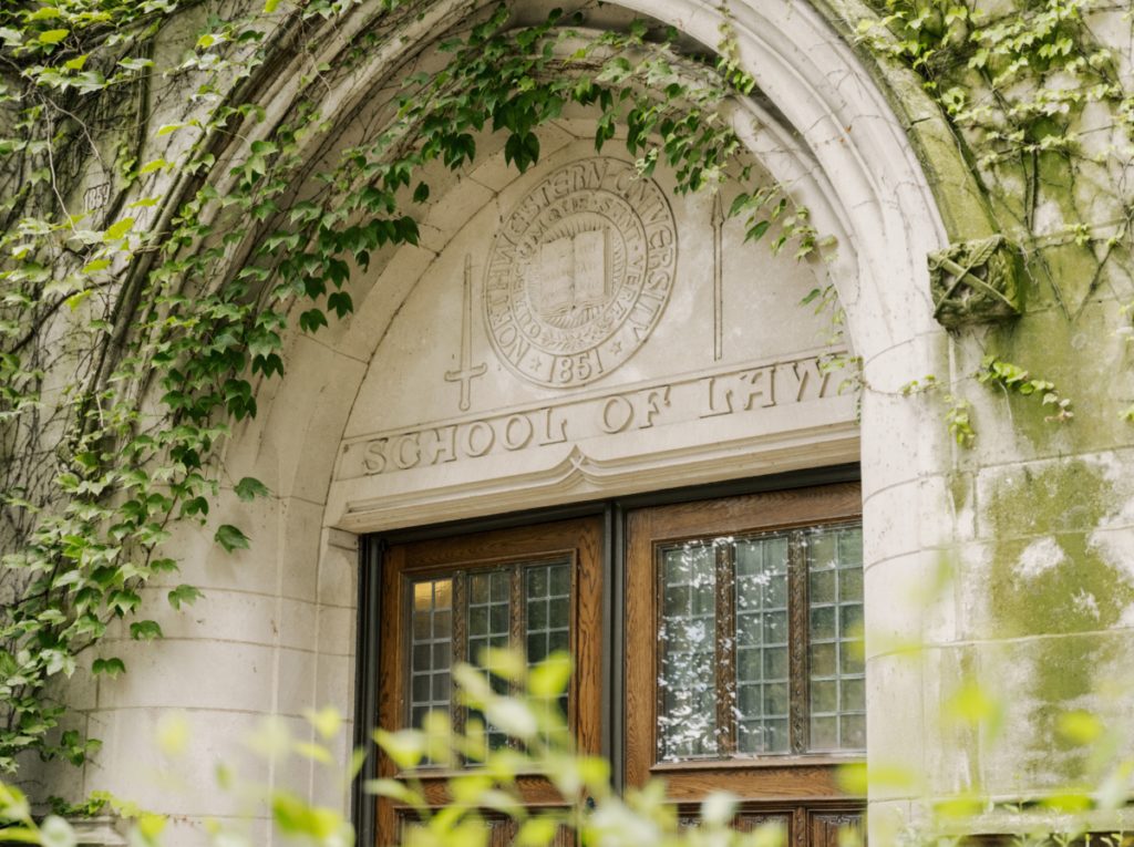 An image of the exterior of McCormick Hall. A stone arch covered in ivy.