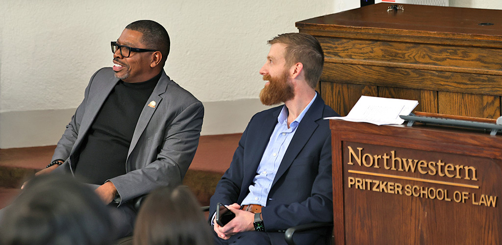 Honorable John Fitzgerald Lyke Jr. seated next to Ben Wideman at the Law School