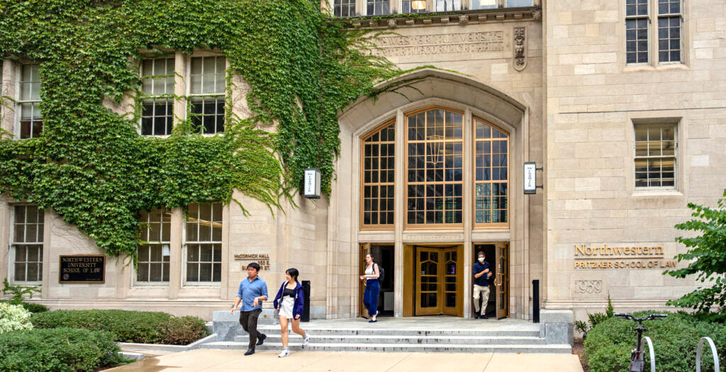 Students walking in front of McCormick building entrance