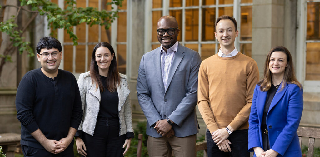 2025 incoming junior faculty pictured in the Law School's courtyard in the fall