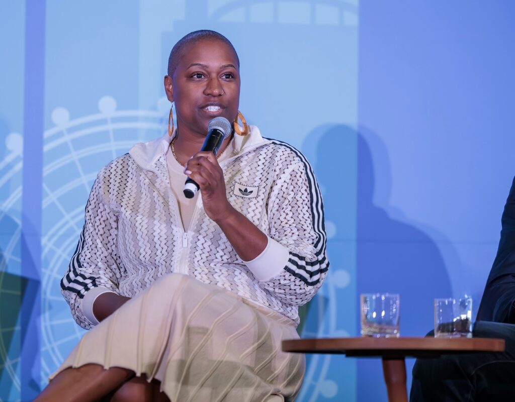 A photo of Tiffany M. Shepard (JD '12) speaking into a microphone. 